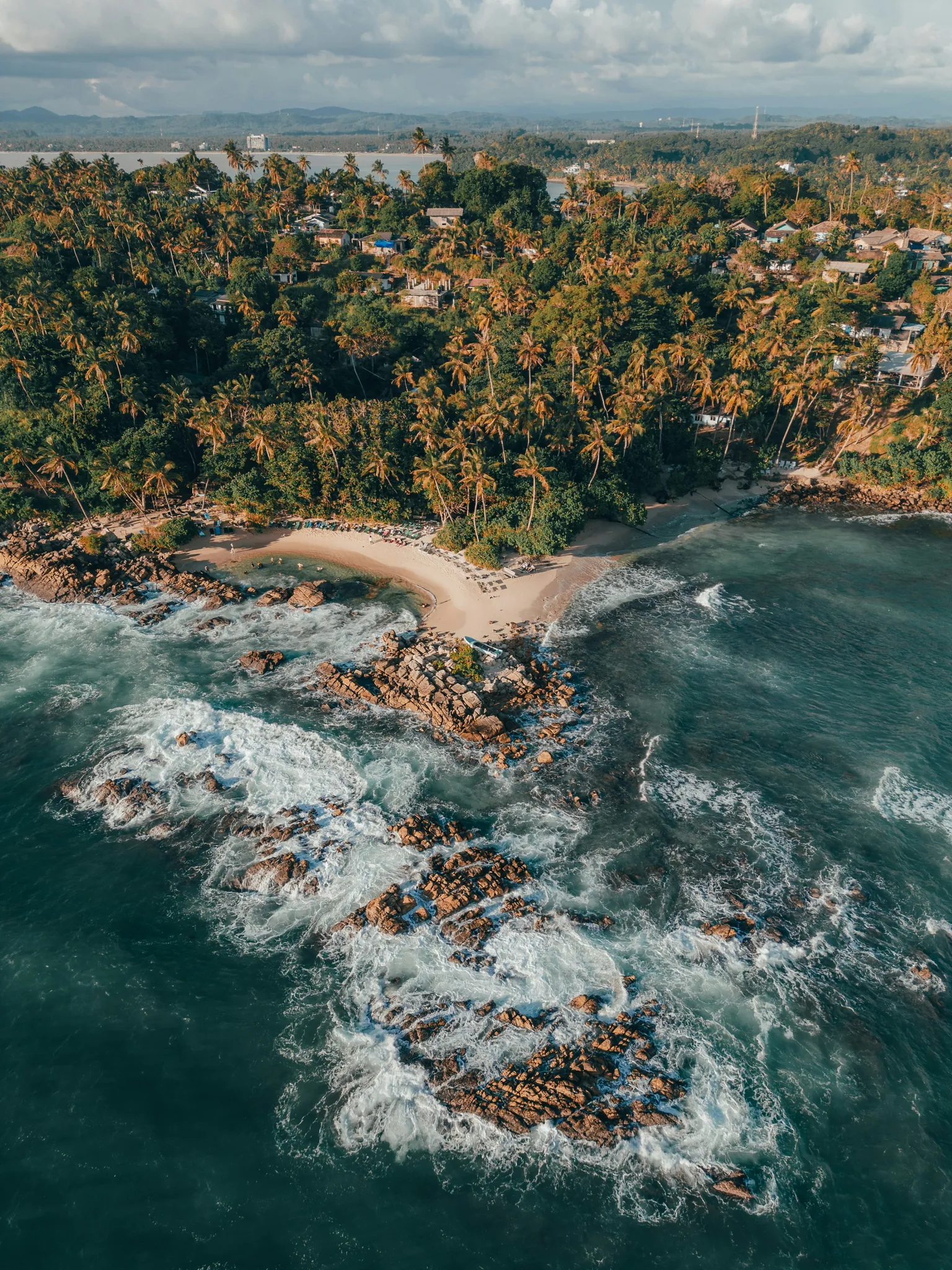 Golden beach and turquoise water in Mirissa
