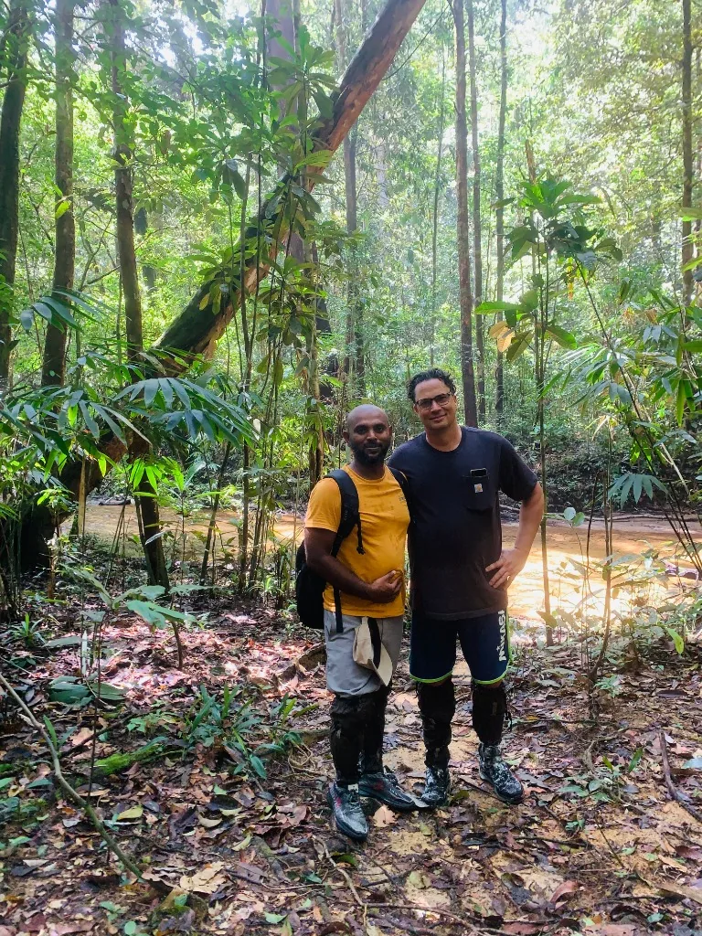 Travelers exploring a Sri Lankan rainforest with their guide